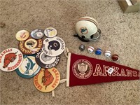 Memorabilia Pins, Football helmets, and flag for