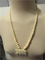 OFF WHITE ELEPHANT NECKLACE LOOKS CARVED