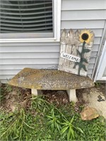 Concrete bench and Welcome sign