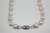 Strand of freshwater pearls with a crystal