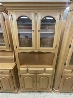 Wooden corner cabinet with glass shelf. No light.