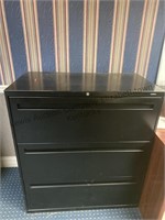 Three drawer, metal file cabinet