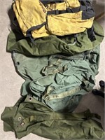 Five military duffle bags