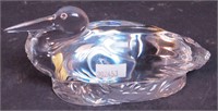 A crystal paperweight of a pelican marked