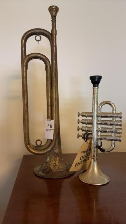 Two Trumpets One is Brass Other Is Plastic