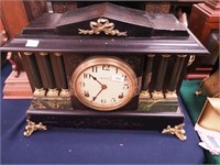 An Ingraham black striking mantel clock with