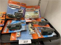 Matchbox military trucks and tanks.