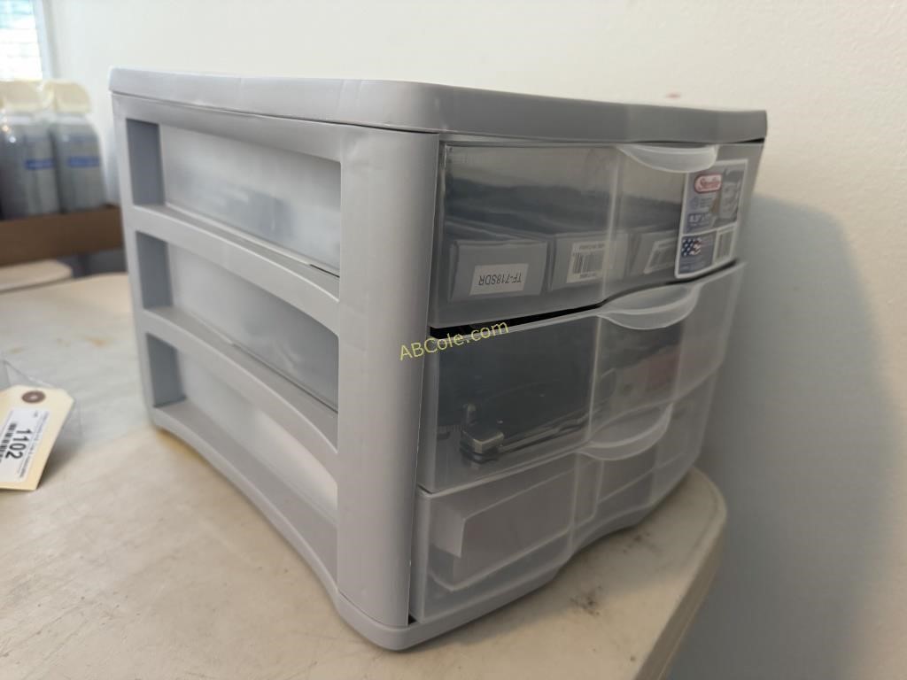 Clear/grey 3- drawer organizer filled with