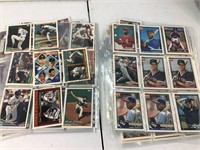 Several sleeves of baseball player cards. See