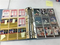 Binder with baseball player trading cards.