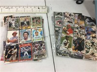 Several sleeves of baseball player cards. See