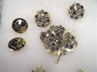 Two brooches with matching earrings, both