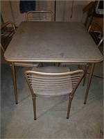Folding table with folding chairs
