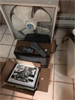Box fan, TV and photos
