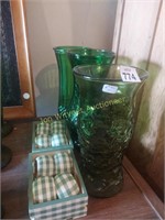 3 green glass vases and napkin rings