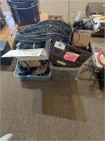 Lot of power cords, cables, TV remotes and other
