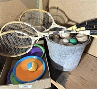 Badminton Rackets, Bucket of Golf Balls, Few