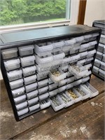 Plastic drawer organizer filled with washers nuts