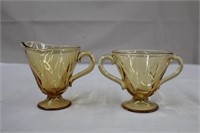 Amber glass creamer and double handled sugar,