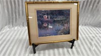 Framed Reproduction Painting of a Lady and Child