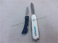 Swiss made advertising utility knife and a Gerber