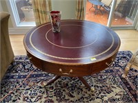 ROUND 48IN GOLD TRIM, LEATHER AND WOOD TABLE ON