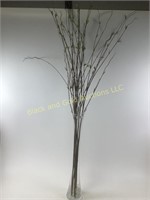 Clear vase with artificial flowers