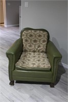 Mid-century modern green leather chair, studded