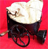 ANTIQUE BLACK SEED SPREADER W SEWN FEED BAG TOP