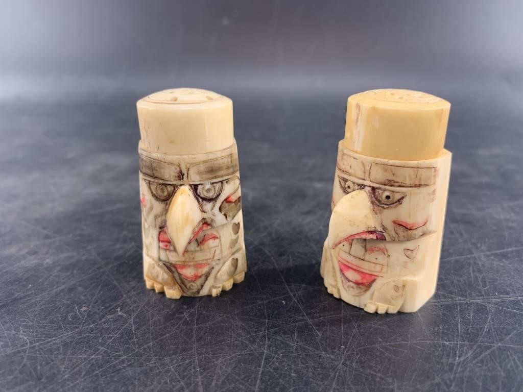 Pair of antique bone salt and pepper shakers carve