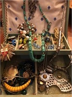 Blue box full of costume jewelry