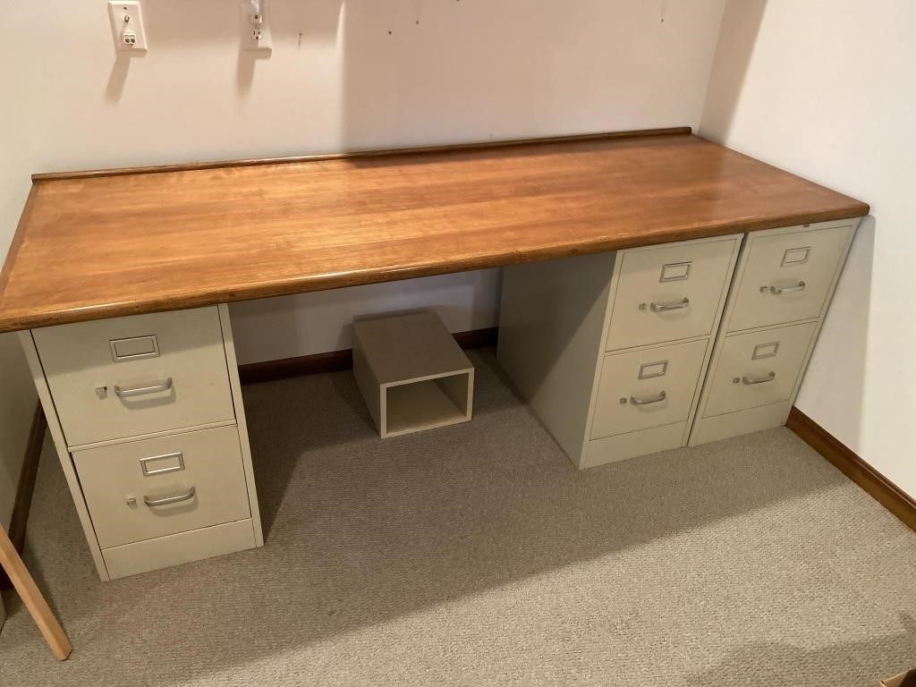 Three  Filing cabinets and desktop.