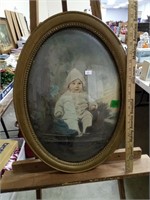 Oval Dome Framed Winter Dressed Child Photograph