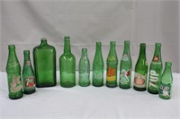 Collection of green bottles, Gilbey's Collins,