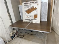 Portable fold away table