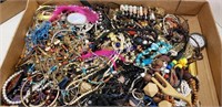 Box lot of unsorted  jewelry