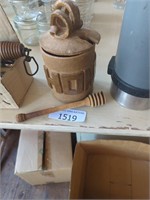 Small decorative honey jar with wooden stir