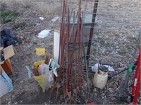 electric fence posts and bucket of misc flags