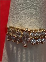 14 K ring with white CZ stones. Size 6 1/2. Lots