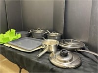 Variety of pots and pans with dish mat and more