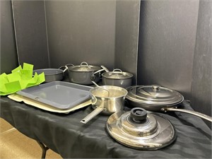 Variety of pots and pans with dish mat and more