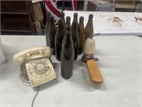 Desk Dial Phone and Wine Bottles