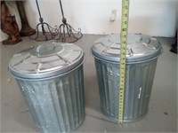 Pair of tin trash cans.