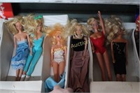 LARGE LOT BARBIE DOLLS IN CARRIER W/ CLOTHES