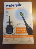 NIB Waterpik Sonic-fusion flossing toothbrush