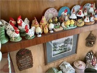 Shelf lot of roosters, salt and pepper, etc.