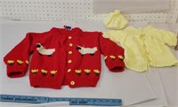 2 hand-knit child's sweaters with one hat