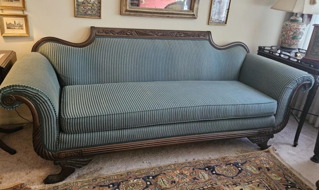 Victorian sofa wth carved wood, nicely covered