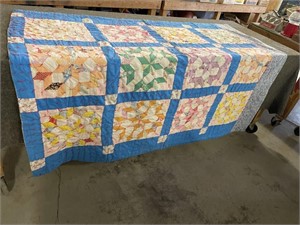 Quilt appears hand crafted
