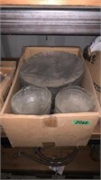 Box of clear bowls and dinner plates